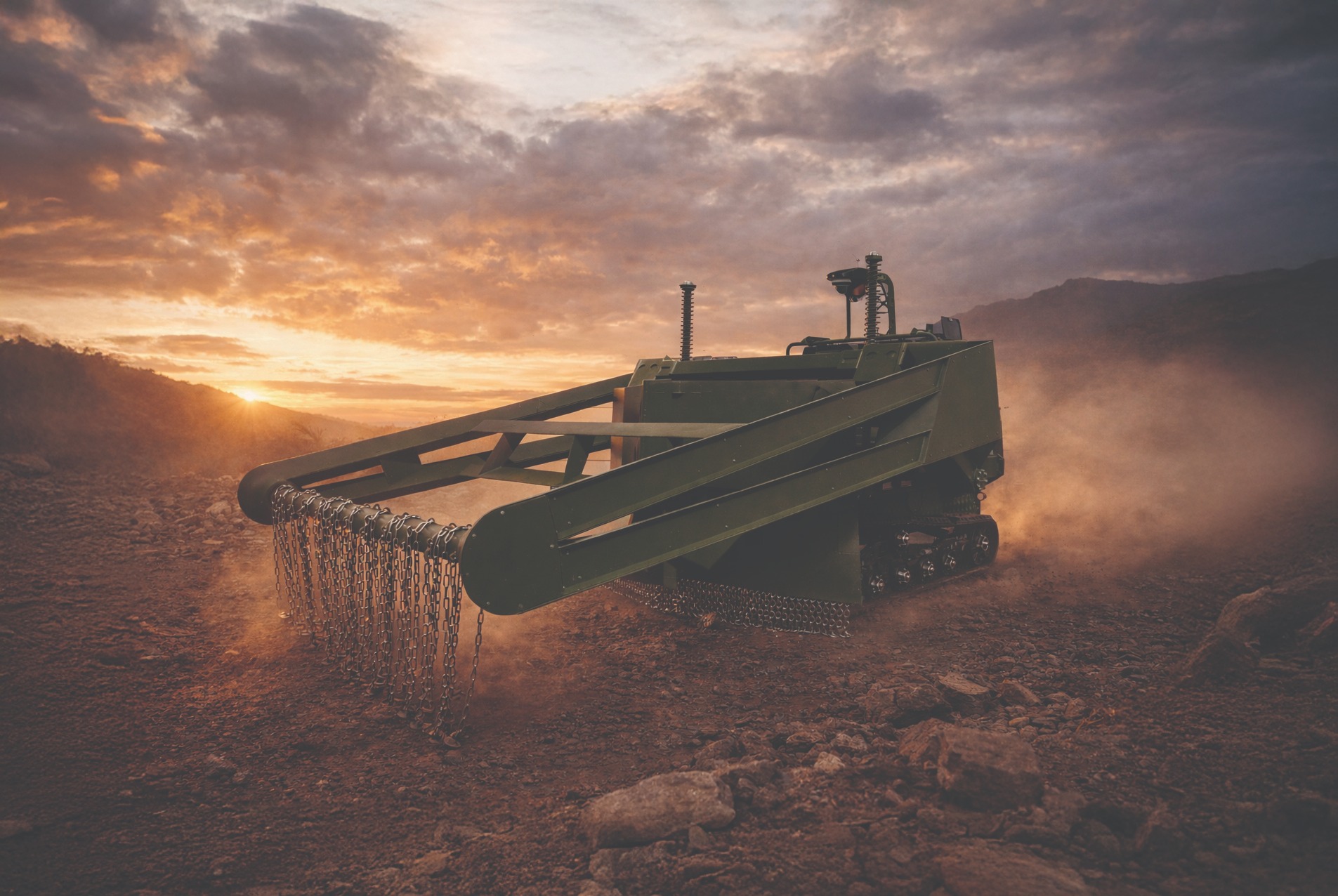 DeMiner system positioned in rocky terrain at sunset, ready for rapid field deployment