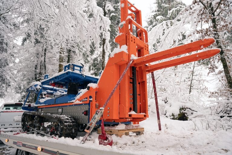 Easy transport of autonomous forklift on light car-trailer, requires only B+E license (no convoys, or permits required)